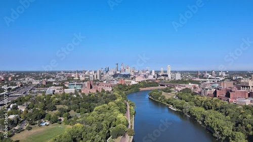 A drone aerial view of the minneapolis skyline just upriver of the mississippi river photo