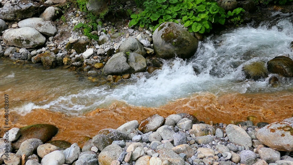 Dirty Polluted Water Flowing Into Clean Brook Dirty Polluted Water Flowing Into Clean Brook