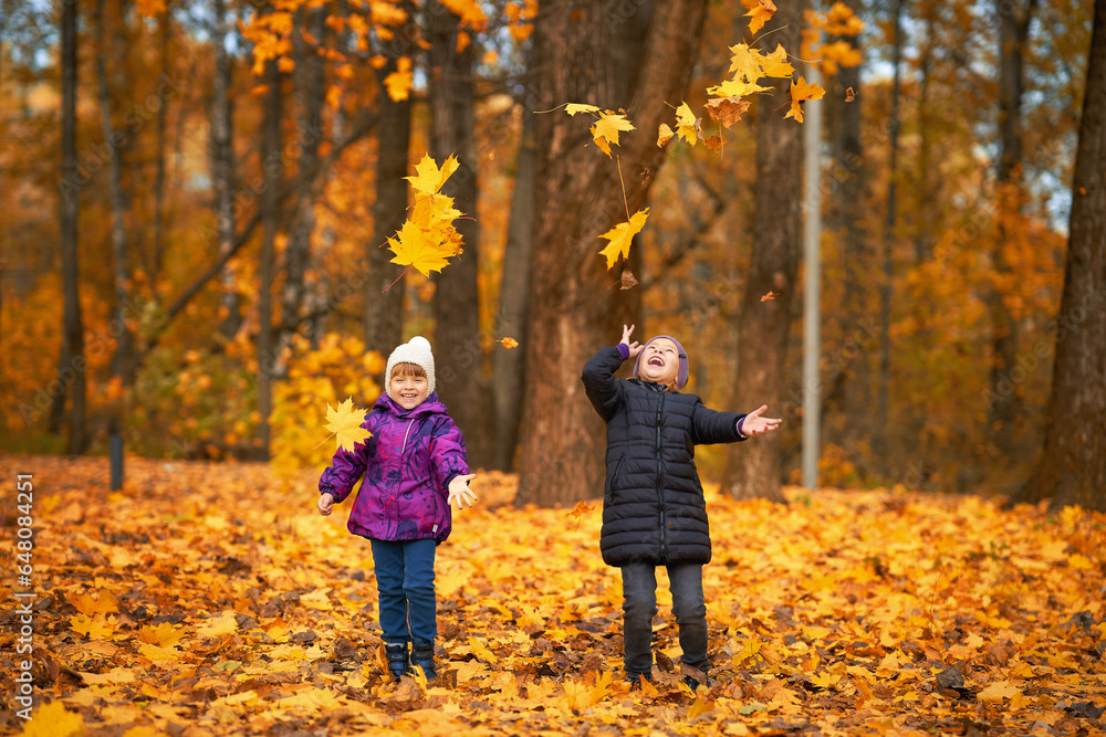 Two children having fun in the autumn forest Two children having fun in the autumn forest