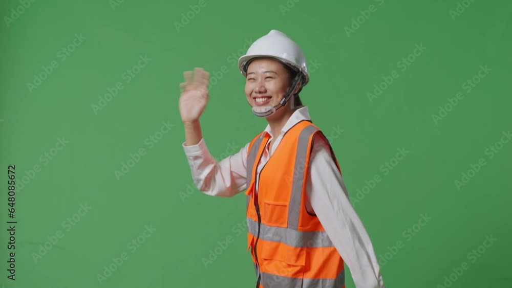 Side View Of Asian Female Engineer With Safety Helmet Working On A Laptop While Walking In The Green Screen Background Studio
Side View Of Asian Female Engineer With Safety Helmet Working On A Laptop While Walking In The Green Screen Background Studio