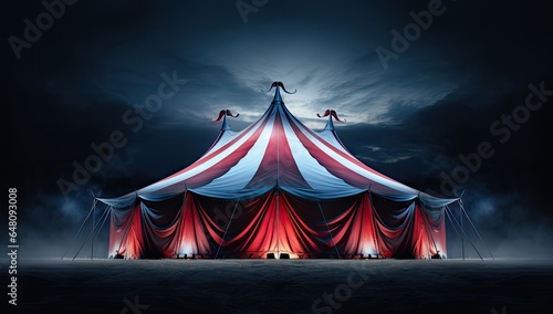 Circus tent and stormy sky in the night.