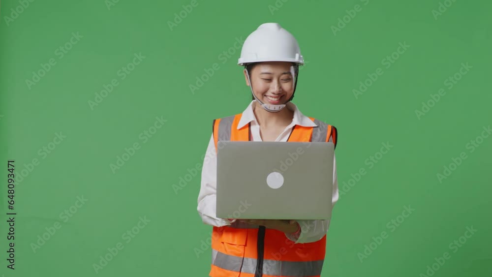 Asian Female Engineer With Safety Helmet Working On A Laptop While Walking In The Green Screen Background Studio
Asian Female Engineer With Safety Helmet Working On A Laptop While Walking In The Green Screen Background Studio