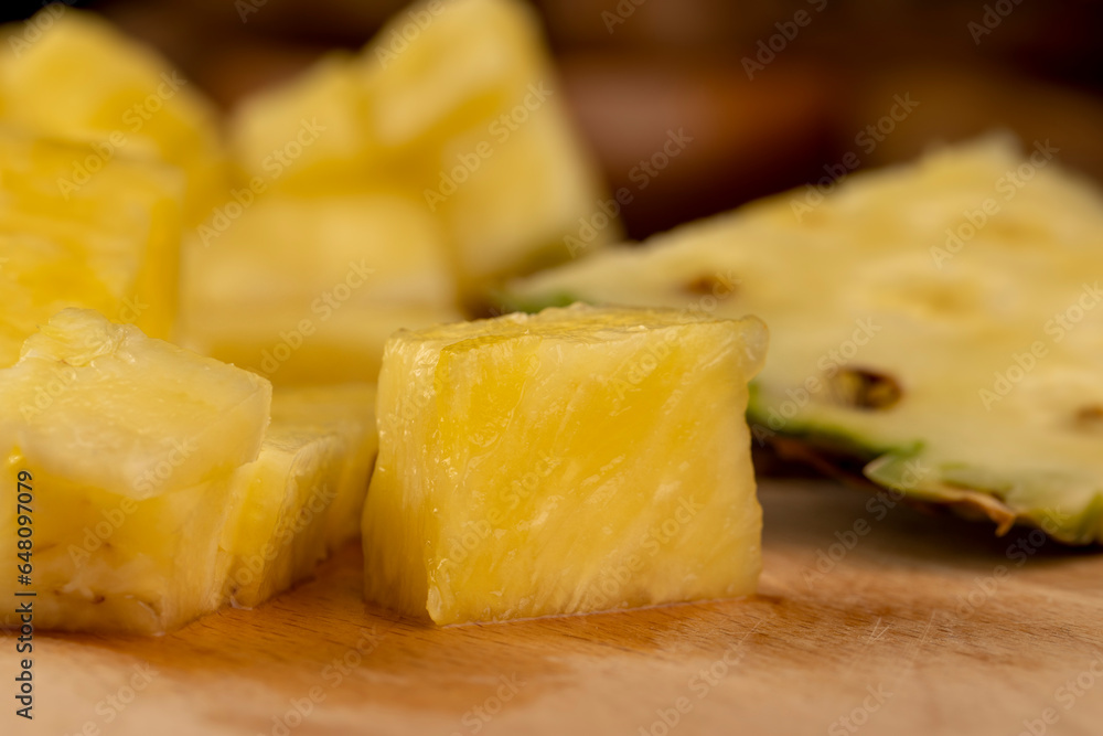 sliced ripe yellow pineapple, a large number of pieces sliced ripe yellow pineapple, a large number of pieces