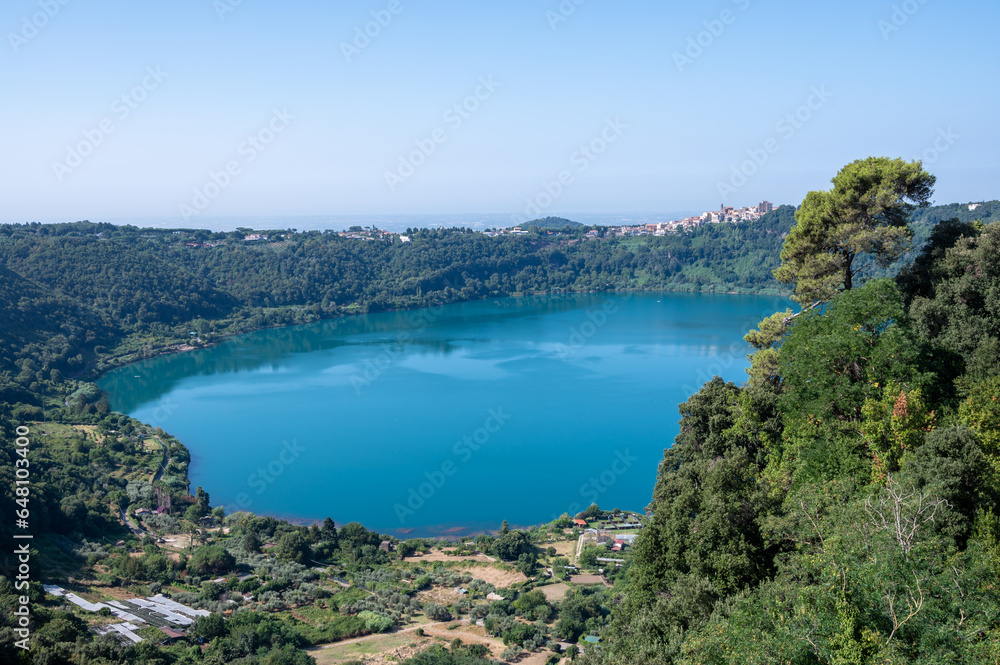 Small historical town Nemi, view on green Alban hills overlooking volcanic crater lake Nemi, Castelli Romani, Italy in summer