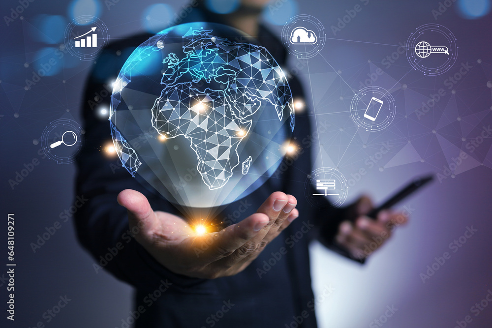 Businessman holding world globe in hologram to connection with no boundary communication information transfer cloud technology website server device search engine to support business activity - obrazy, fototapety, plakaty 