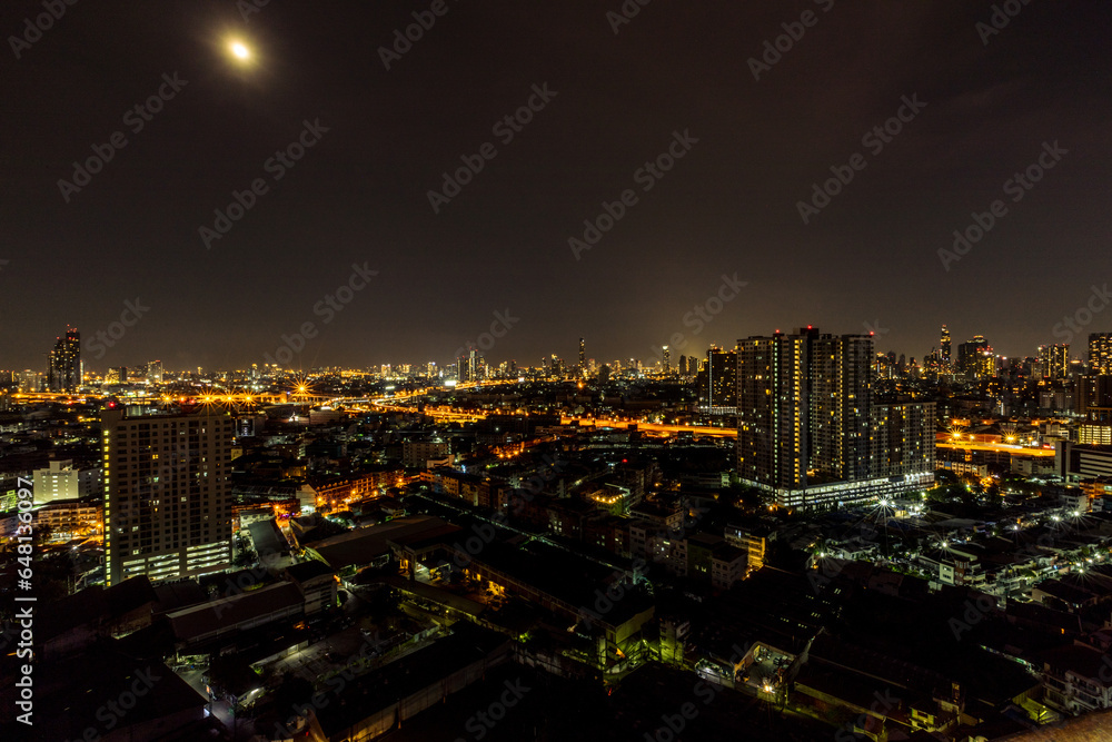 Fototapeta premium Panorama background of city views, high-rise buildings (condominiums, offices, housing estates, expressways) and many connecting roads, blown through the blur