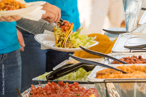 Fresh and Healthy Veggie Tacos: Preparing a Delicious Dish at a Taco Bar