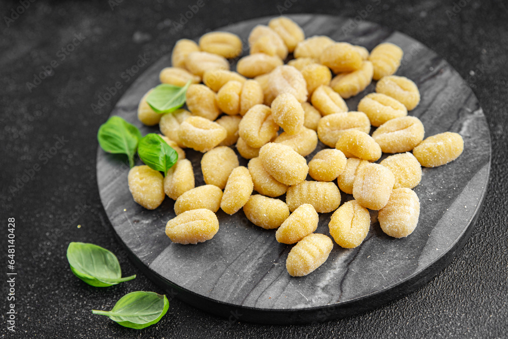 gnocchi raw potato food second course cooking appetizer meal food snack on the table copy space food background rustic top view keto or paleo diet gnocchi raw potato food second course cooking appetizer meal food snack on the table copy space food background rustic top view keto or paleo diet