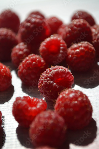raspberries on the table photography of plants