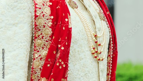 Close up view of Indian Groom wearing traditional wedding Wear Sherwani photo