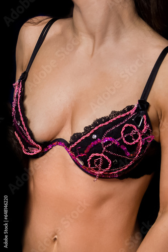 Female body erotic concept in bra with vintage patterns
