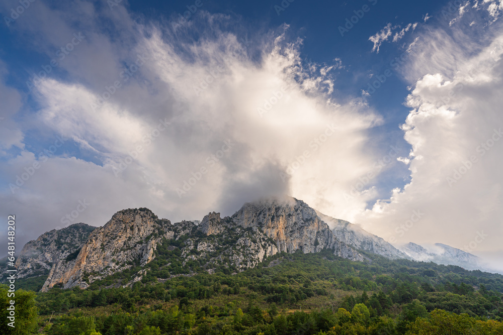 Scenic mountain landscape view in the French Pyrenees under bright clouds, Boulzane valley, Aude, France