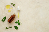 Herbal or tea tree essential oil in dropper bottle. Cosmetic products concept