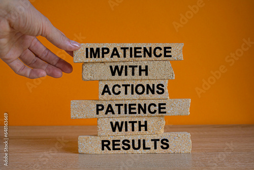 Action and result symbol. Concept words Impatience with actions patience with results on brick blocks. Beautiful orange background copy space. Businessman hand. Business action result concept.