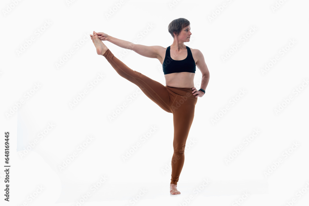 Utthita hasta padangusthasana (Extended hand to big toe pose 2), Ashtanga yoga Woman wearing sportswear doing Yoga exercise against white background. Utthita hasta padangusthasana (Extended hand to big toe pose 2), Ashtanga yoga Woman wearing sportswear doing Yoga exercise against white background.