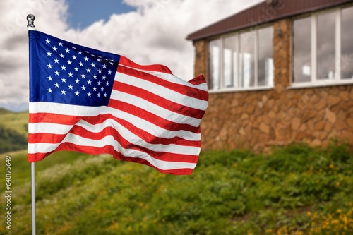 US flag displayed in front of house for patriotism,