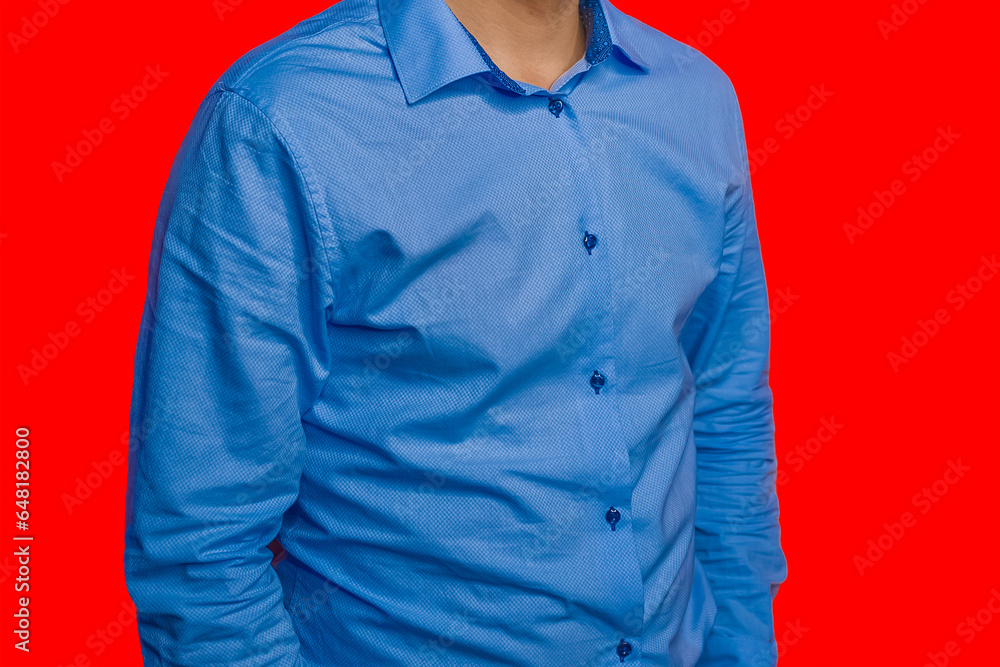 Men's business style clothing fashion blue shirt on red isolated background Men's business style clothing fashion blue shirt on red isolated background