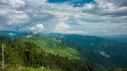 Timelapse of moving clouds and a river from chota kailash, uttarakhand photo