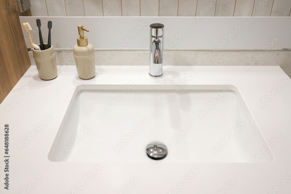 Chrome faucet and granite sink in the bathroom Chrome faucet and granite sink in the bathroom