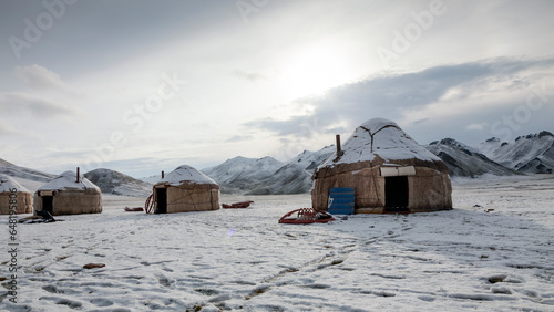 yurt camp in the Tien Shan mountains under snow photo