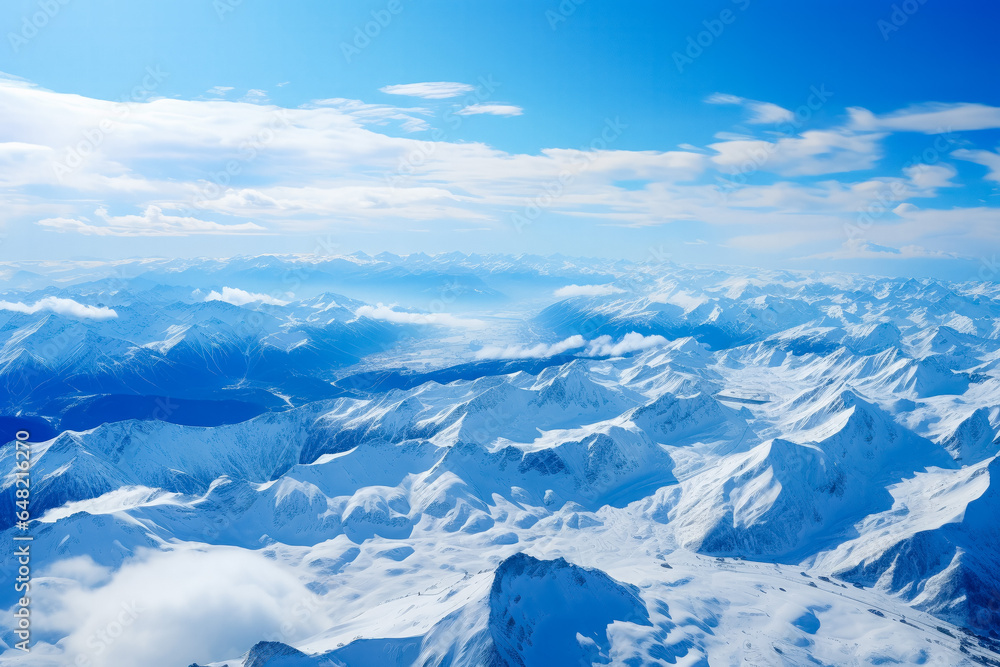 Obraz premium Aerial view from the plane to ski resort mountains 