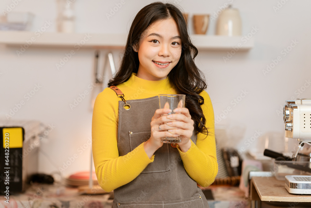 Small business owner, successful businesswoman, beautiful woman standing in coffee shop Portrait of a tanned Asian woman, barista, cafe, business concept owner, seller, SME Small business owner, successful businesswoman, beautiful woman standing in coffee shop Portrait of a tanned Asian woman, barista, cafe, business concept owner, seller, SME