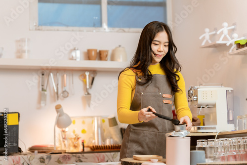 Small business owner, successful businesswoman, beautiful woman standing in coffee shop Portrait of a tanned Asian woman, barista, cafe, business concept owner, seller, SME