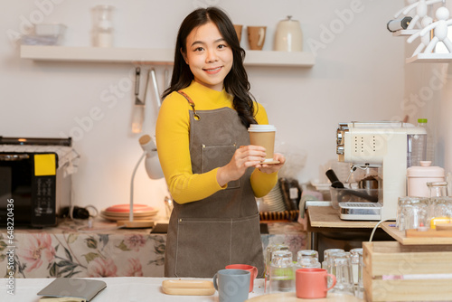 Small business owner, successful businesswoman, beautiful woman standing in coffee shop Portrait of a tanned Asian woman, barista, cafe, business concept owner, seller, SME