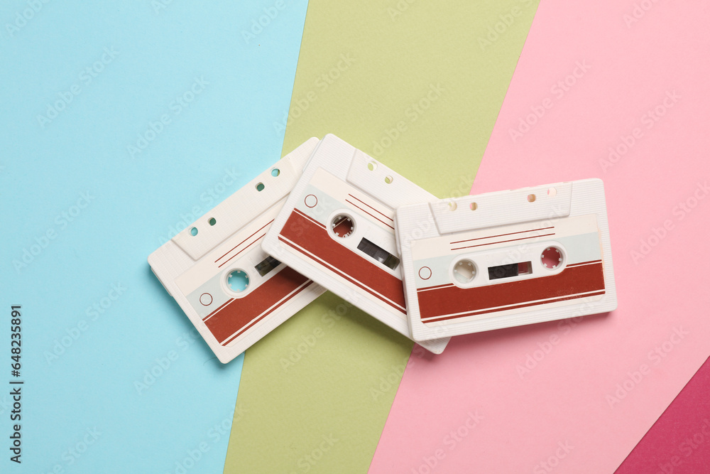 Retro 80s audio cassettes on a colored background. Top view Retro 80s audio cassettes on a colored background. Top view