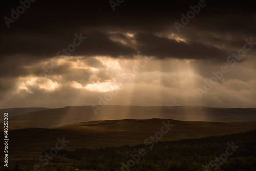 Sunbeams shining through dark storm clouds; Applecross peninsula wester ross scotland