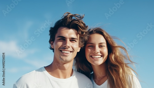 Young Couple Smiling and Posing on Blue Background