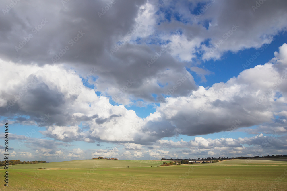 Expanse Of Green Field Under Blue Sky And Cloud; Hertfordshire, England Expanse Of Green Field Under Blue Sky And Cloud; Hertfordshire, England
