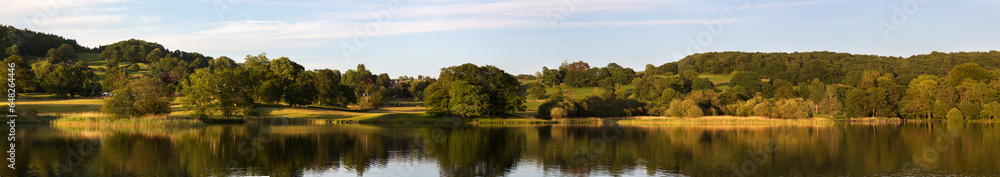 Panoramic Landscape Reflected In A Tranquil Lake; Lake District, Cumbria, England Panoramic Landscape Reflected In A Tranquil Lake; Lake District, Cumbria, England