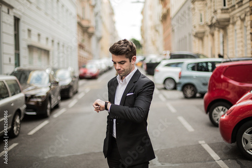 Smart Man in Suit Posing in City Streets