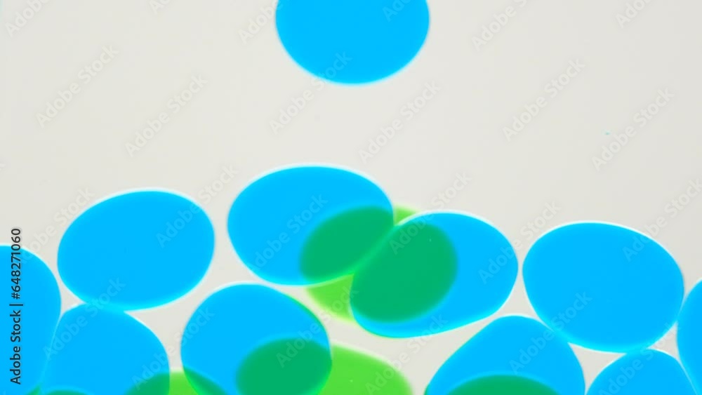 Close up and slow motion of various sizes of transparent liquid bubbles floating down Close up and slow motion of various sizes of transparent liquid bubbles floating down
