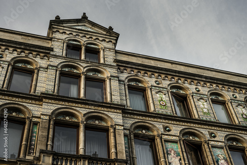 Very rare Art-Nouveau façade of a former grand magasin, ancestor of the mall. End of the XIXth century. Glazed bricks.