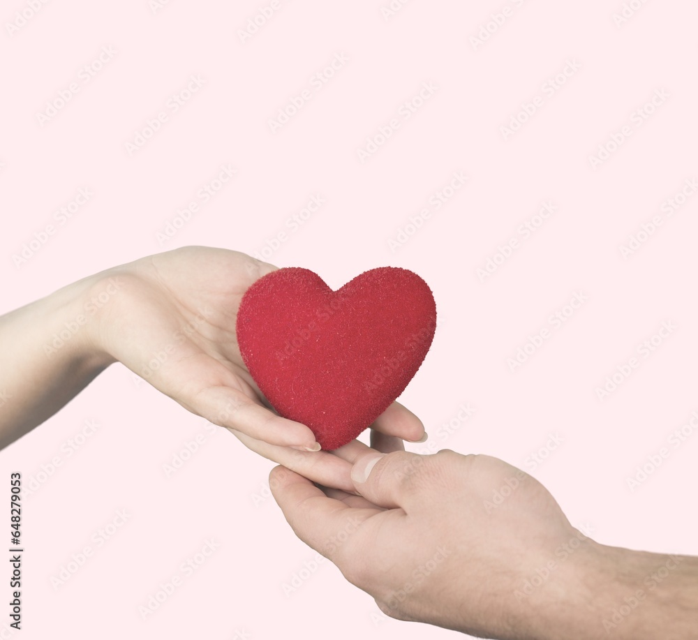 Obraz premium Human hand Giving a heart, valentine's day