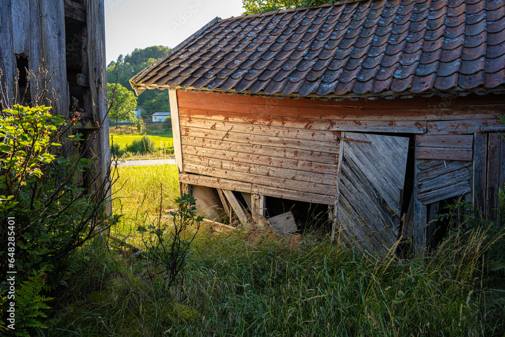Old abandoned red barn where the paint has come of. Old abandoned red barn where the paint has come of.