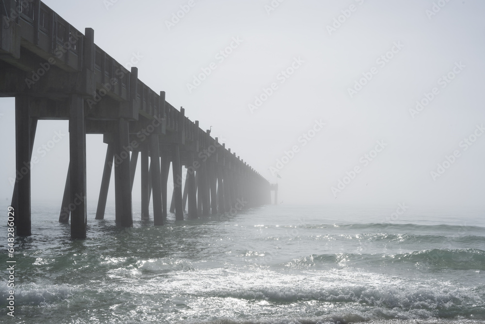 fog on pier on beach 