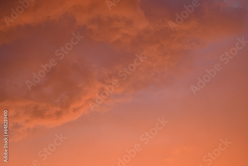 evening sunset, rays of the sun through cirrus pink clouds against the background of the sunset sky, 