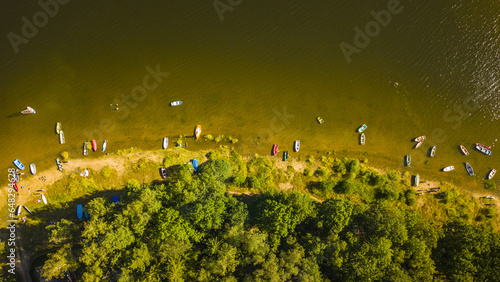 Top down view of beach on lake Sec with many boats. Popular tourist summer destination in Pardubicky kraj, Czech republic, European union.