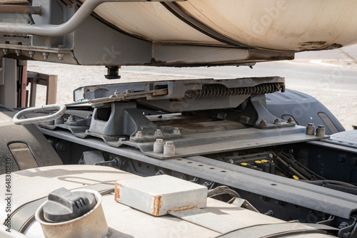 Fifth wheel of the truck unhooked from the kingpin of the semi-trailer, close-up.