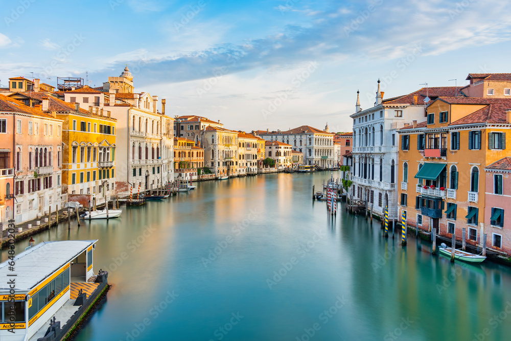 Long exposure picture with the Grand Canal at sunset or sunrise in Venice, Italy.