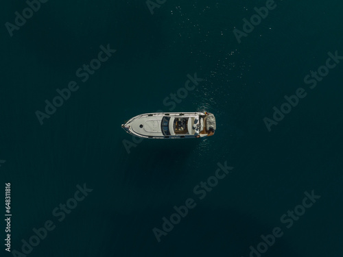 Drone topdown shot of a yacht, sailing boat