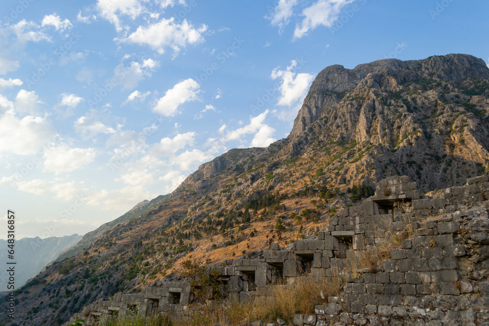 A view of a castle wall on a rocky mountain at Kotor Bay in Montenegro