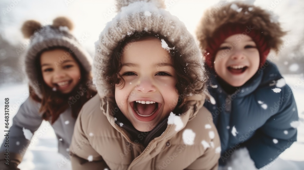 Happy group of children playing in the snow during winter.