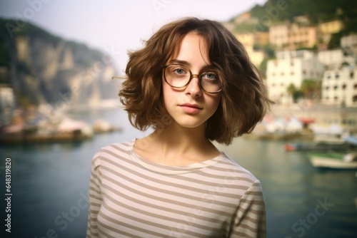 Portrait of a Fictional Young Brunette Woman with Glasses Posing Outdoors. Generative AI. © Tuyres
