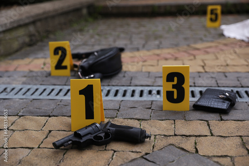 Crime scene markers and evidences outdoors, closeup