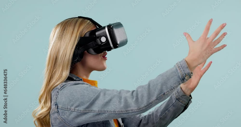 Vr, wow or woman in metaverse studio for future innovation or 3d gaming on blue background. Futuristic media, technology software or excited girl gamer with digital virtual reality glasses online Vr, wow or woman in metaverse studio for future innovation or 3d gaming on blue background. Futuristic media, technology software or excited girl gamer with digital virtual reality glasses online