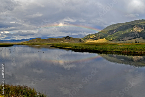Canvas-taulu Faint rainbow reflection in Flat Creek, Wyoming